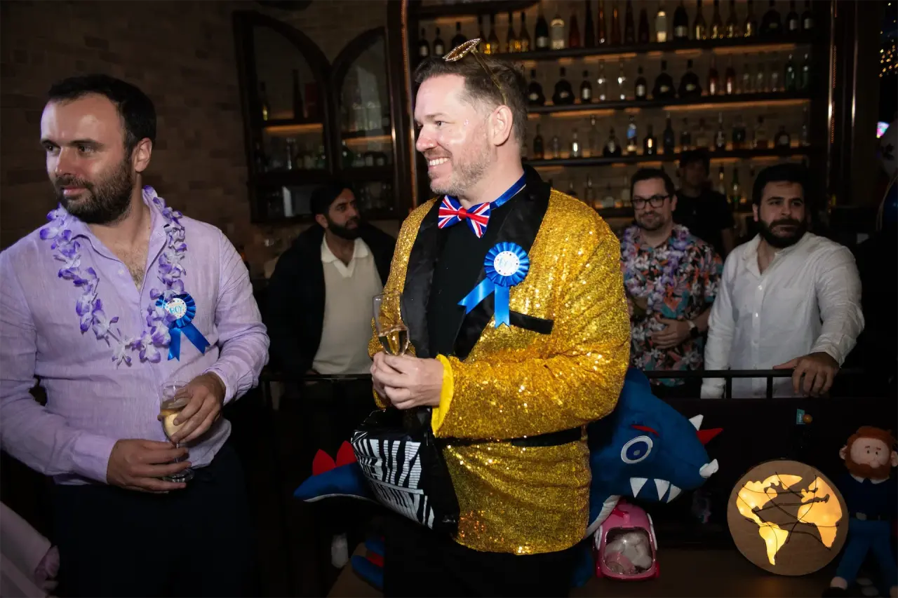 Zapiet CEO Andy dressed in a gold sequin jacket with Union Jack bow tie, channeling Elton John at the Epic Party.